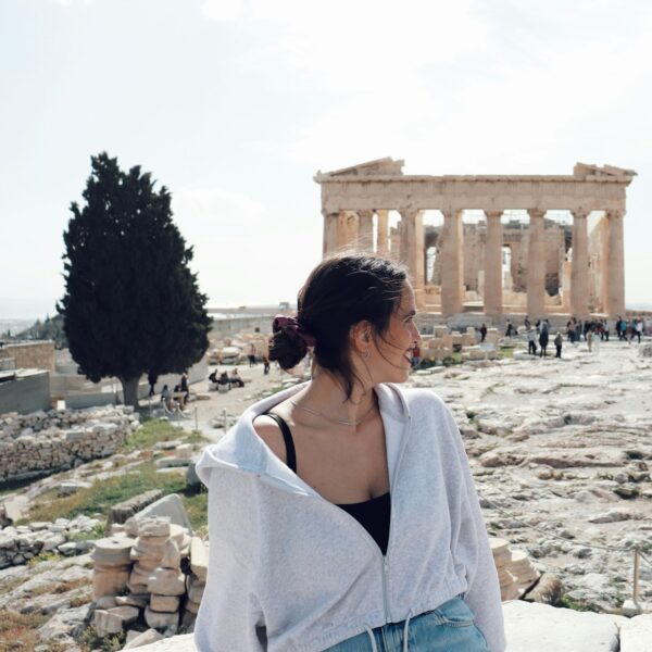 a woman standing in front of the part of a building