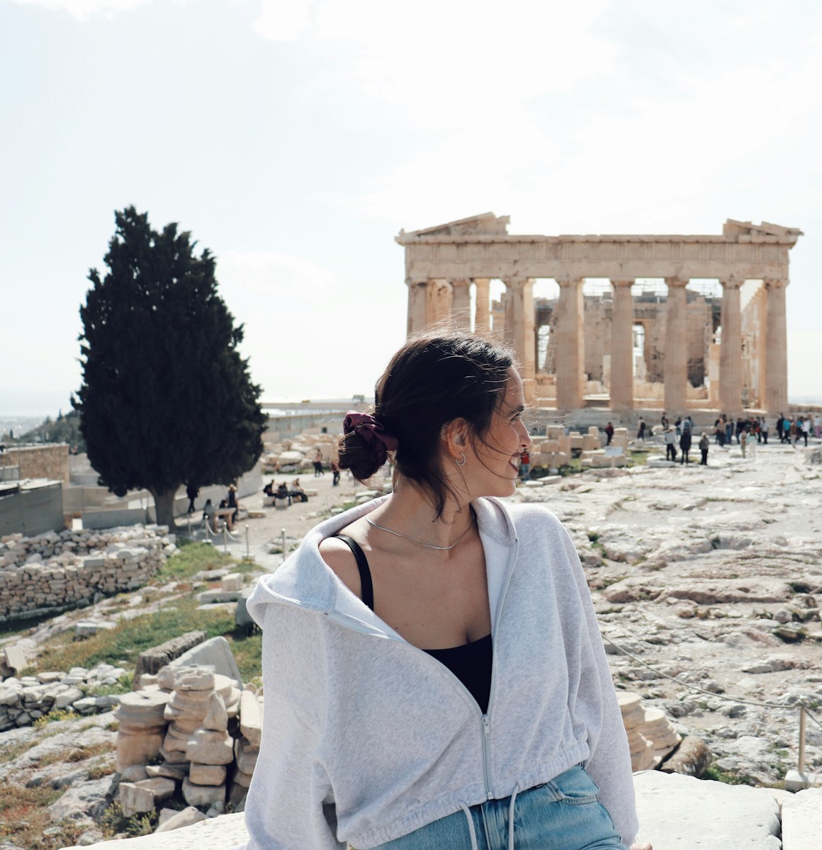 a woman standing in front of the part of a building