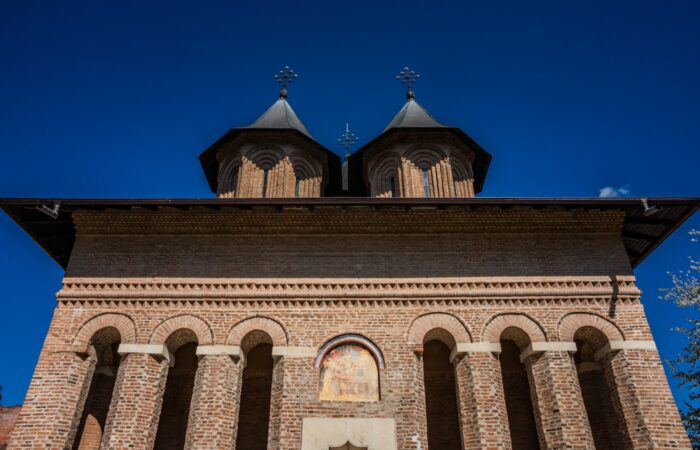 A tall tower with a clock on top of it