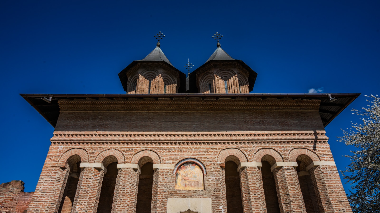 A tall tower with a clock on top of it
